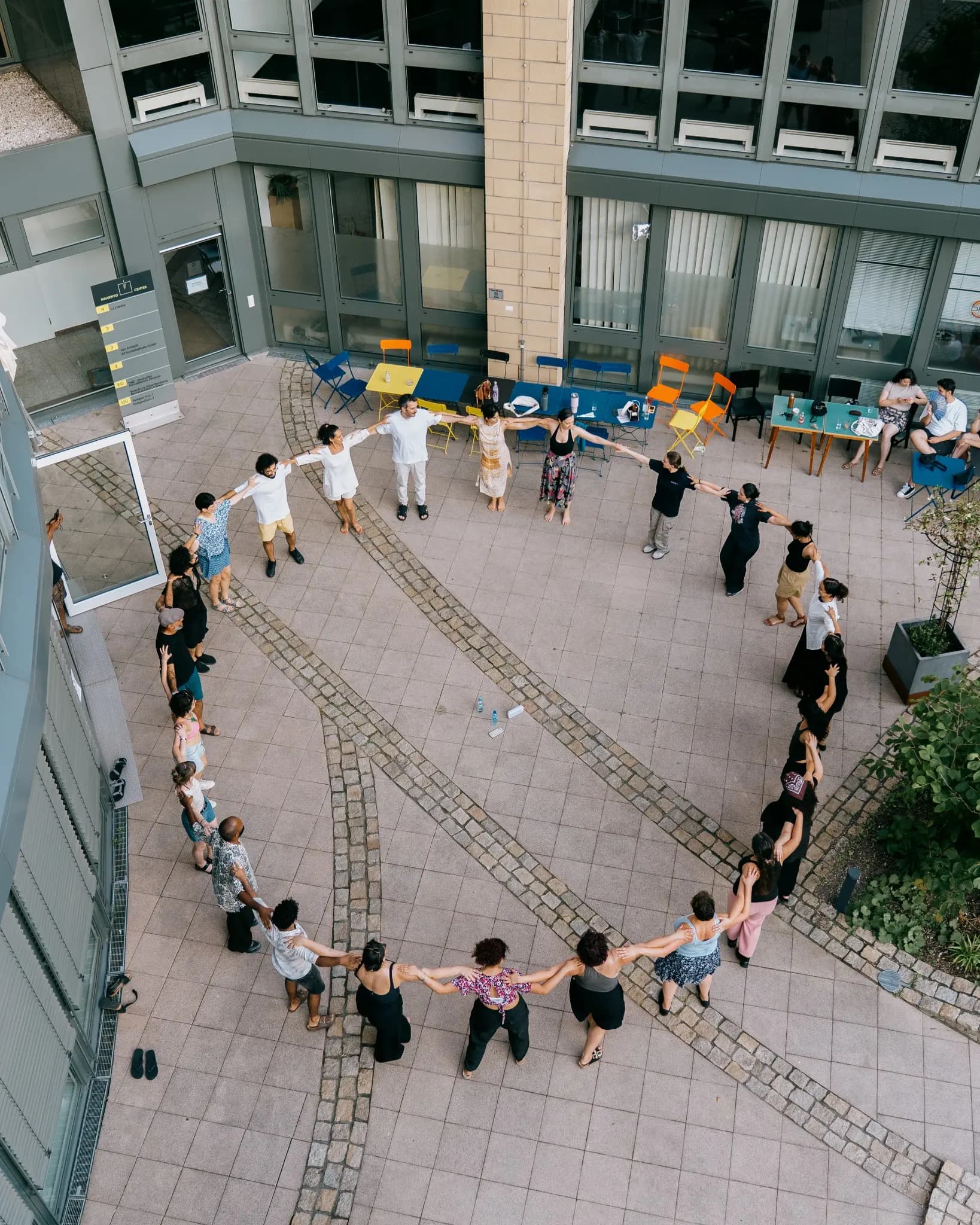 People dancing Dabke together in a large courtyard circle